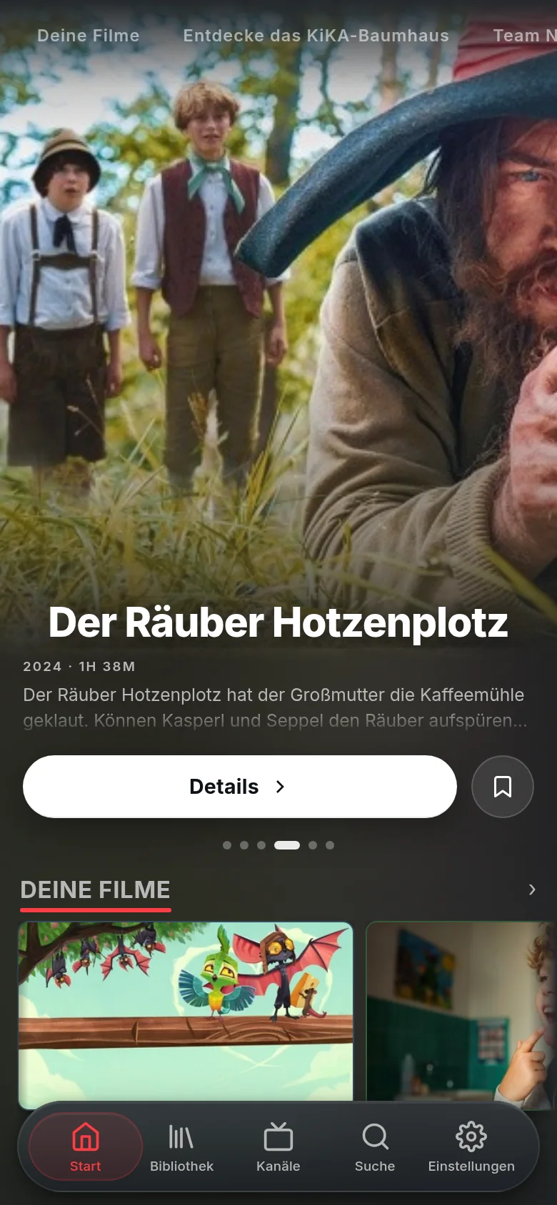Vuma auf einem Handy: ein hervorgehobener KiKA-Film (Der Räuber Hotzenplotz) mit Details- und Merklisten-Button über einer Reihe von Filmen.